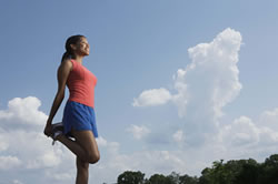 woman stretching leg